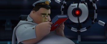 Movie still from “WALL·E” (2008), directed by Andrew Stanton – An animated character is holding an electronic device in his hands; Medium shot, High angle