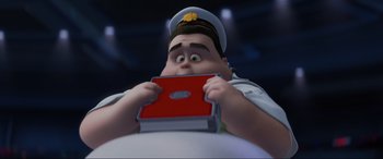 Movie still from “WALL·E” (2008), directed by Andrew Stanton – An animated character holding a book in front of his face; Close Up shot, High angle