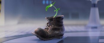 Movie still from “WALL·E” (2008), directed by Andrew Stanton – A plant growing out of a boot on top of a table; Extreme Close Up shot, Low angle