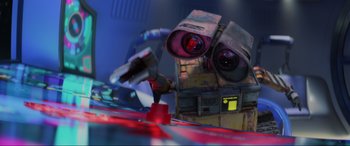 Movie still from “WALL·E” (2008), directed by Andrew Stanton – An image of a robot with two eyes and two hands; Close Up shot, Low angle