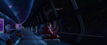 Movie still from “WALL·E” (2008), directed by Andrew Stanton – A cat sitting in a chair looking out of a window at the stars; Extreme Wide shot, High angle