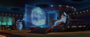 Movie still from “WALL·E” (2008), directed by Andrew Stanton – An animated scene of a woman sitting in a chair in front of a projection screen; Wide shot, Low angle