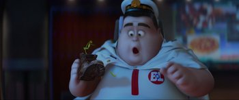 Movie still from “WALL·E” (2008), directed by Andrew Stanton – A character holding a piece of food; Close Up shot, High angle