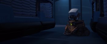 Movie still from “WALL·E” (2008), directed by Andrew Stanton – An image of an animated character in a room; Wide shot, High angle