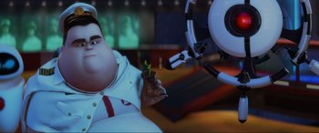 Movie still from “WALL·E” (2008), directed by Andrew Stanton – An image of an animated character holding a plant in his hand; Medium shot, Low angle