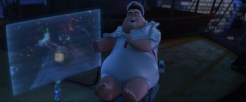 Movie still from “WALL·E” (2008), directed by Andrew Stanton – A cartoon character is sitting in a chair; Wide shot, Low angle