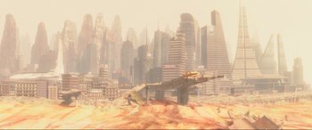 Movie still from “WALL·E” (2008), directed by Andrew Stanton – An image of an airplane in the middle of a city; Extreme Wide shot, High angle