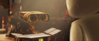 Movie still from “WALL·E” (2008), directed by Andrew Stanton – An image of a robot looking through binoculars; Extreme Close Up shot, Low angle