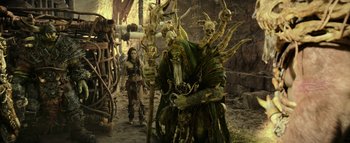 Movie still from “Warcraft” (2016), directed by Duncan Jones – A man and a woman standing next to each other; Wide shot, Low angle