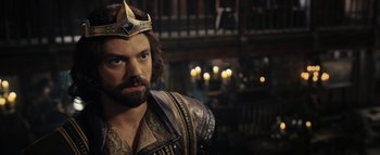Movie still from “Warcraft” (2016), directed by Duncan Jones – A man with a beard wearing a crown; Close Up shot, High angle
