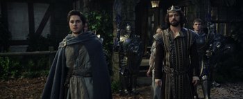 Movie still from “Warcraft” (2016), directed by Duncan Jones – A group of men in medieval garb standing next to each other; Medium shot, Over the shoulder angle