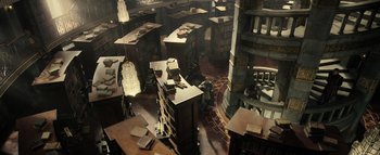 Movie still from “Warcraft” (2016), directed by Duncan Jones – An aerial view of a library with people sitting in it; Extreme Wide shot, High angle