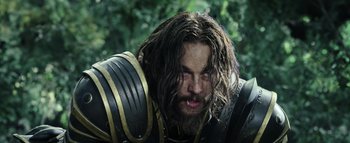 Movie still from “Warcraft” (2016), directed by Duncan Jones – A person with long hair and a beard; Close Up shot, Low angle