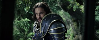 Movie still from “Warcraft” (2016), directed by Duncan Jones – A person wearing a suit of armor; Close Up shot, Low angle