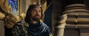 Movie still from “Warcraft” (2016), directed by Duncan Jones – A man with a beard wearing a crown; Close Up shot, Low angle