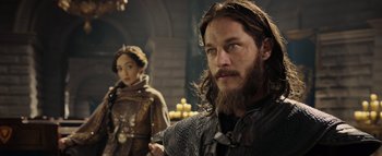 Movie still from “Warcraft” (2016), directed by Duncan Jones – A man and a woman standing next to each other; Close Up shot, Over the shoulder angle