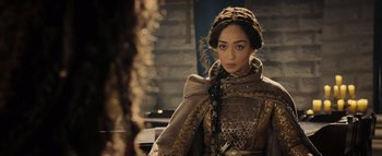Movie still from “Warcraft” (2016), directed by Duncan Jones – A woman in a medieval dress looking at a mirror; Close Up shot, Over the shoulder angle