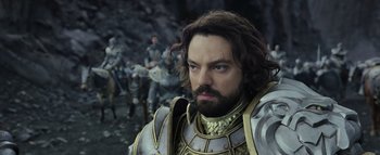 Movie still from “Warcraft” (2016), directed by Duncan Jones – A person wearing a suit of armor; Close Up shot, Over the shoulder angle