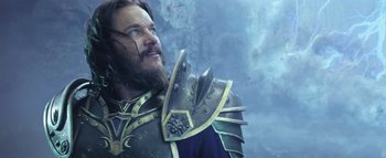 Movie still from “Warcraft” (2016), directed by Duncan Jones – A man with a beard wearing a metal armor; Close Up shot, Low angle