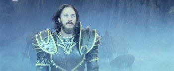 Movie still from “Warcraft” (2016), directed by Duncan Jones – A man with a beard wearing a suit of armor; Close Up shot, Low angle