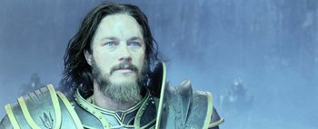 Movie still from “Warcraft” (2016), directed by Duncan Jones – A person with a beard wearing armor; Close Up shot, Low angle