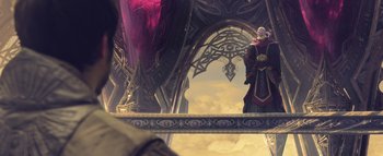 Movie still from “Warcraft” (2016), directed by Duncan Jones – An image of a person standing in front of a building; Wide shot, Low angle