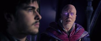 Movie still from “Warcraft” (2016), directed by Duncan Jones – A man and a man in a purple jacket looking at each other; Medium shot, Over the shoulder angle