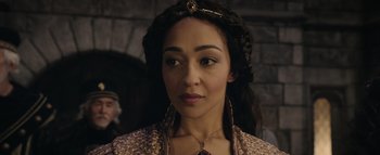 Movie still from “Warcraft” (2016), directed by Duncan Jones – A person wearing a necklace; Close Up shot, Over the shoulder angle