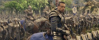 Movie still from “Warcraft” (2016), directed by Duncan Jones – A group of men riding on the back of horses; Medium shot, Over the shoulder angle
