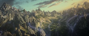 Movie still from “Warcraft” (2016), directed by Duncan Jones – An aerial view of a mountain range in the distance; Extreme Wide shot, Overhead angle