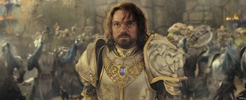 Movie still from “Warcraft” (2016), directed by Duncan Jones – A person wearing a suit of armor; Close Up shot, Low angle