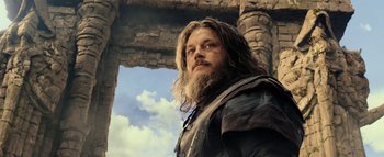 Movie still from “Warcraft” (2016), directed by Duncan Jones – A man with long hair and a long beard; Close Up shot, Low angle
