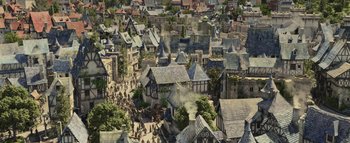 Movie still from “Warcraft” (2016), directed by Duncan Jones – An aerial view of a medieval town with a lot of buildings; Extreme Wide shot, High angle