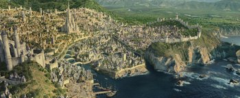 Movie still from “Warcraft” (2016), directed by Duncan Jones – An aerial view of a city and a body of water; Extreme Wide shot, High angle