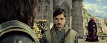 Movie still from “Warcraft” (2016), directed by Duncan Jones – A man with a beard is looking at a woman; Close Up shot, Over the shoulder angle