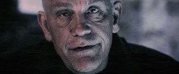 Movie still from “Warm Bodies” (2013), directed by Jonathan Levine – An older man with a shaved head and a goatee; Extreme Close Up shot, Low angle