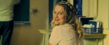 Movie still from “Warm Bodies” (2013), directed by Jonathan Levine – A beautiful blonde woman smiling for the camera; Close Up shot, Over the shoulder angle