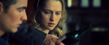 Movie still from “Warm Bodies” (2013), directed by Jonathan Levine – A beautiful young lady holding a wine bottle; Close Up shot, Over the shoulder angle