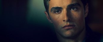 Movie still from “Warm Bodies” (2013), directed by Jonathan Levine – A young man's face with blue eyes; Close Up shot, Low angle