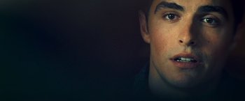 Movie still from “Warm Bodies” (2013), directed by Jonathan Levine – A young man's face with dark lighting; Extreme Close Up shot, Low angle