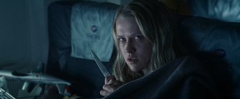 Movie still from “Warm Bodies” (2013), directed by Jonathan Levine – A woman holding a knife in a dark room; Close Up shot, Low angle