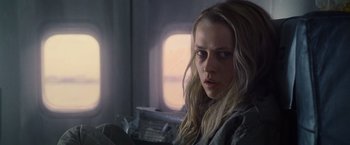 Movie still from “Warm Bodies” (2013), directed by Jonathan Levine – A woman with long blonde hair sitting in a chair; Close Up shot, Low angle