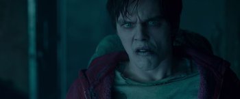 Movie still from “Warm Bodies” (2013), directed by Jonathan Levine – A person with a red jacket; Close Up shot, Over the shoulder angle