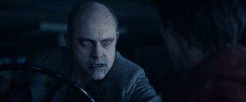 Movie still from “Warm Bodies” (2013), directed by Jonathan Levine – A person with a beard looking at the camera; Close Up shot, Over the shoulder angle