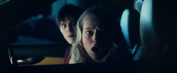 Movie still from “Warm Bodies” (2013), directed by Jonathan Levine – Two young people in the back seat of a car; Close Up shot, Over the shoulder angle