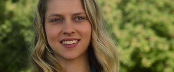 Movie still from “Warm Bodies” (2013), directed by Jonathan Levine – A woman's face in a park setting; Close Up shot, Over the shoulder angle