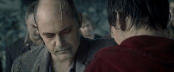 Movie still from “Warm Bodies” (2013), directed by Jonathan Levine – An older man is looking down at a younger man; Close Up shot, Over the shoulder angle