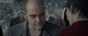 Movie still from “Warm Bodies” (2013), directed by Jonathan Levine – A person with a bald head; Close Up shot, Over the shoulder angle