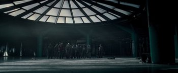 Movie still from “Warm Bodies” (2013), directed by Jonathan Levine – A group of people standing in front of a building; Extreme Wide shot, Low angle