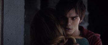 Movie still from “Warm Bodies” (2013), directed by Jonathan Levine – A man and a woman embracing each other in the dark; Close Up shot, Over the shoulder angle